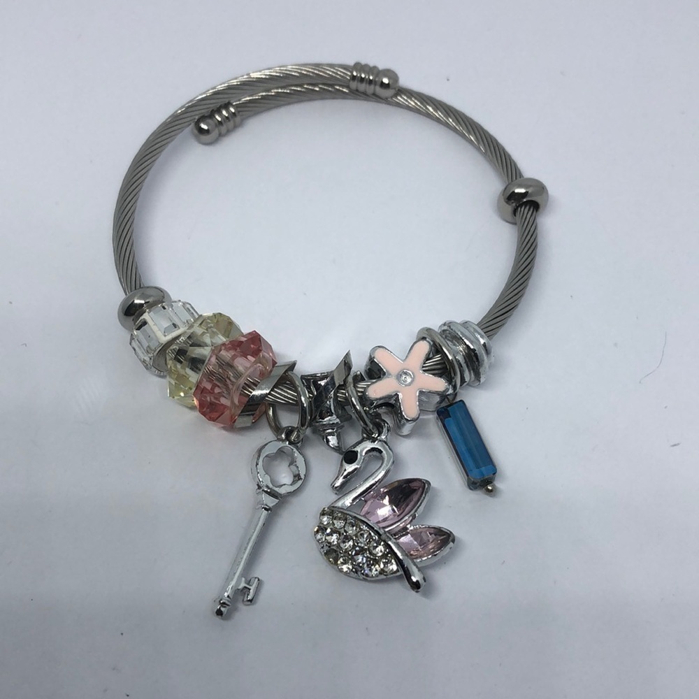 SILVER tone memory coil rope slide and dangle charm bracelet swan key flower.